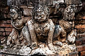 Thailand, Old Sukhothai - Wat Mahathat, stucco figures that decorate the base of the multi-layered chedi to the South of the complex. 